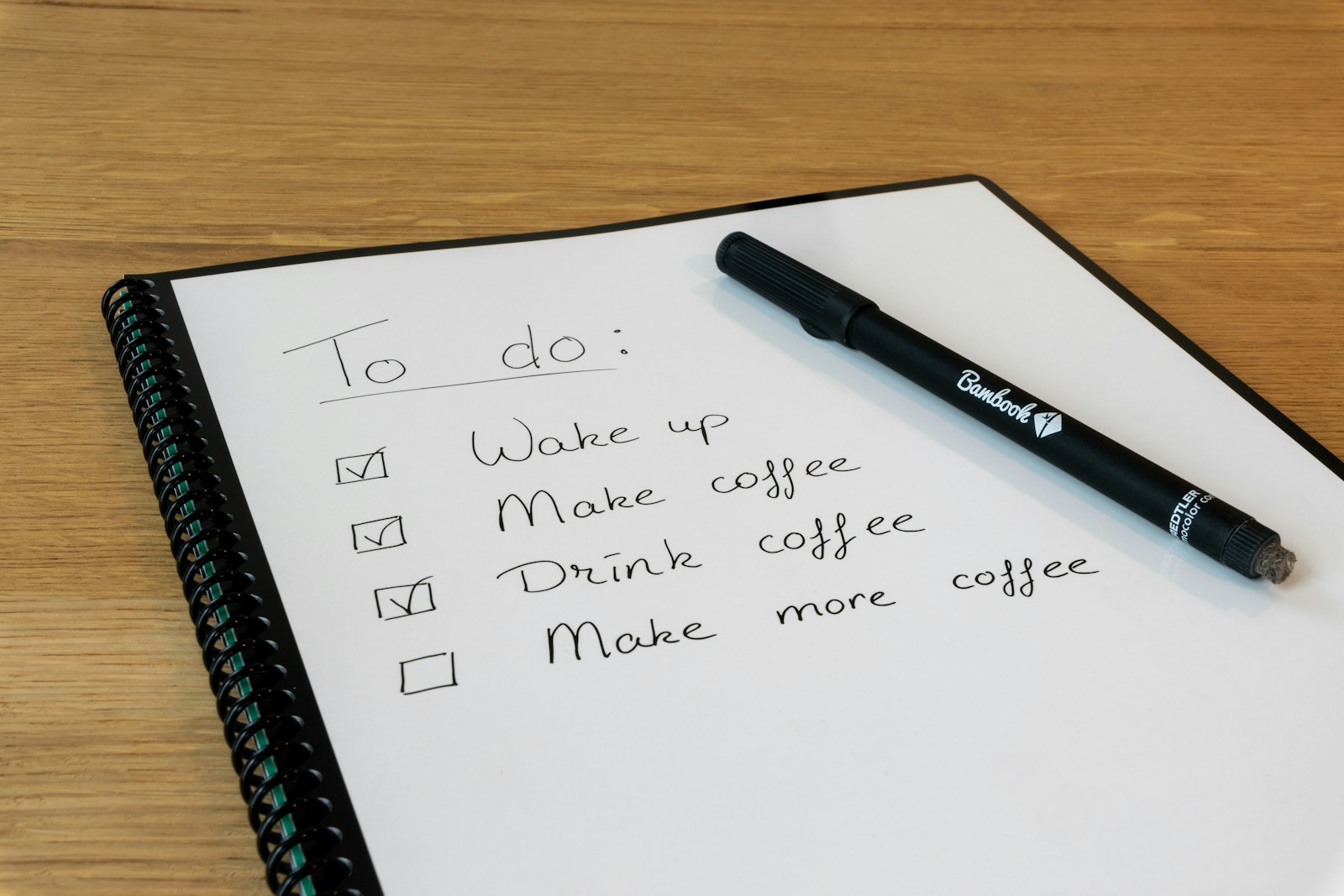 A notepad with a pen resting on it